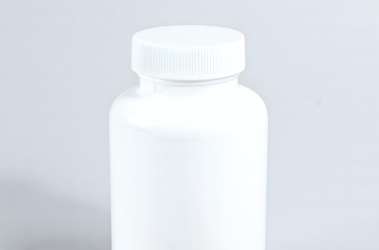 Supplements Beside White Plastic Bottle