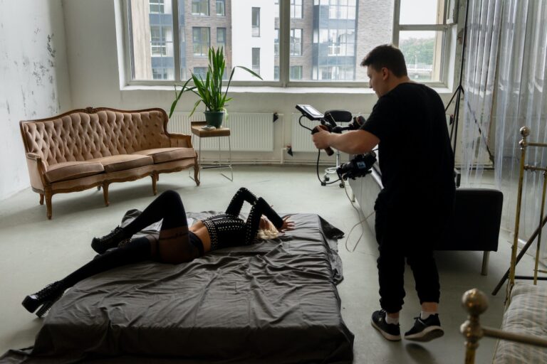 Couple taking photos in modern apartment