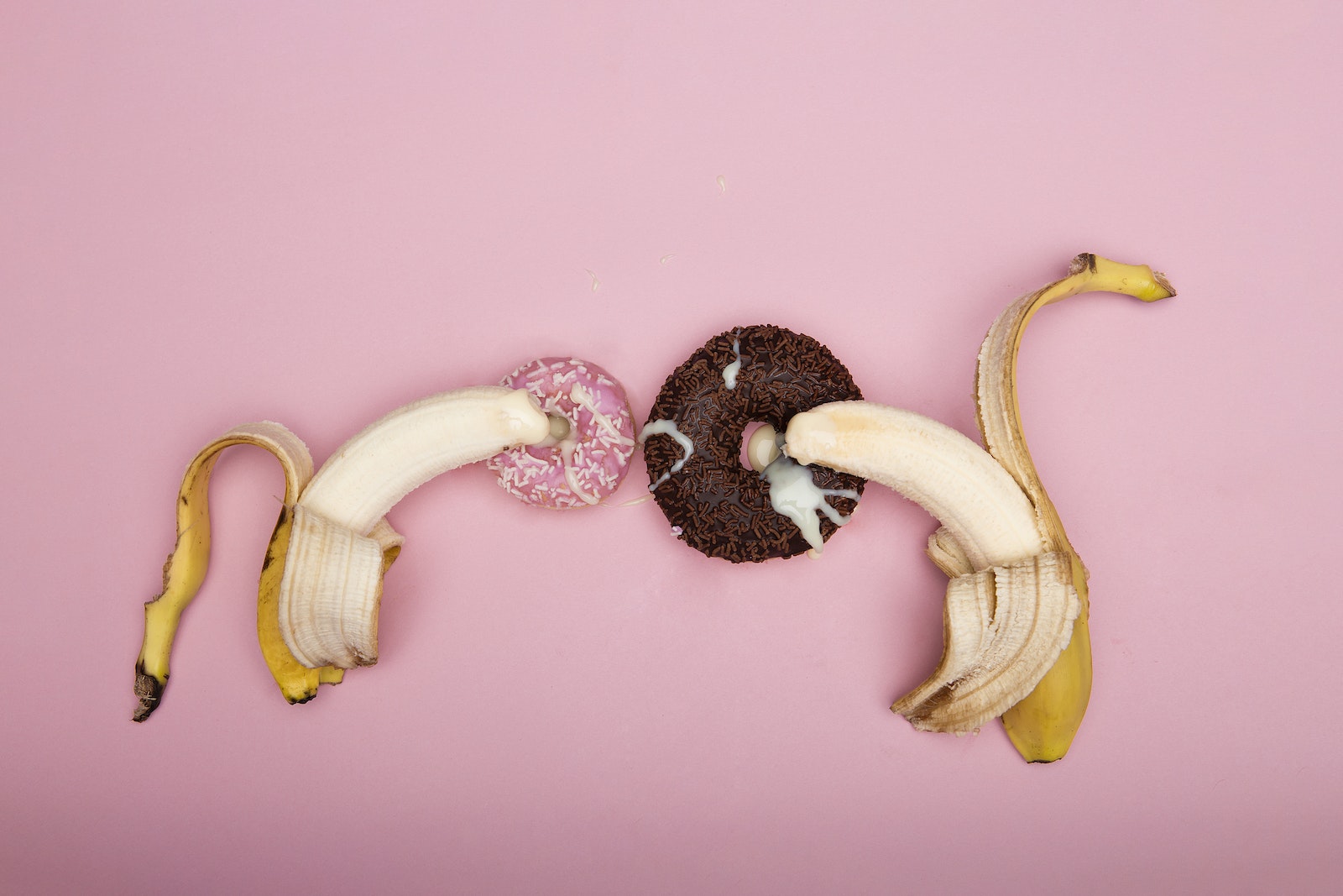 Peeled Banana on Pink Background