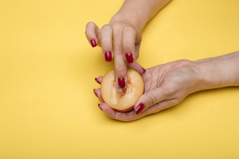 A Person Holding Sliced Fruit