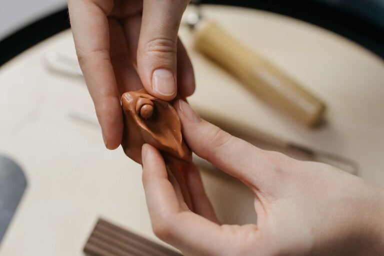 Person Holding a Sculpted Clay