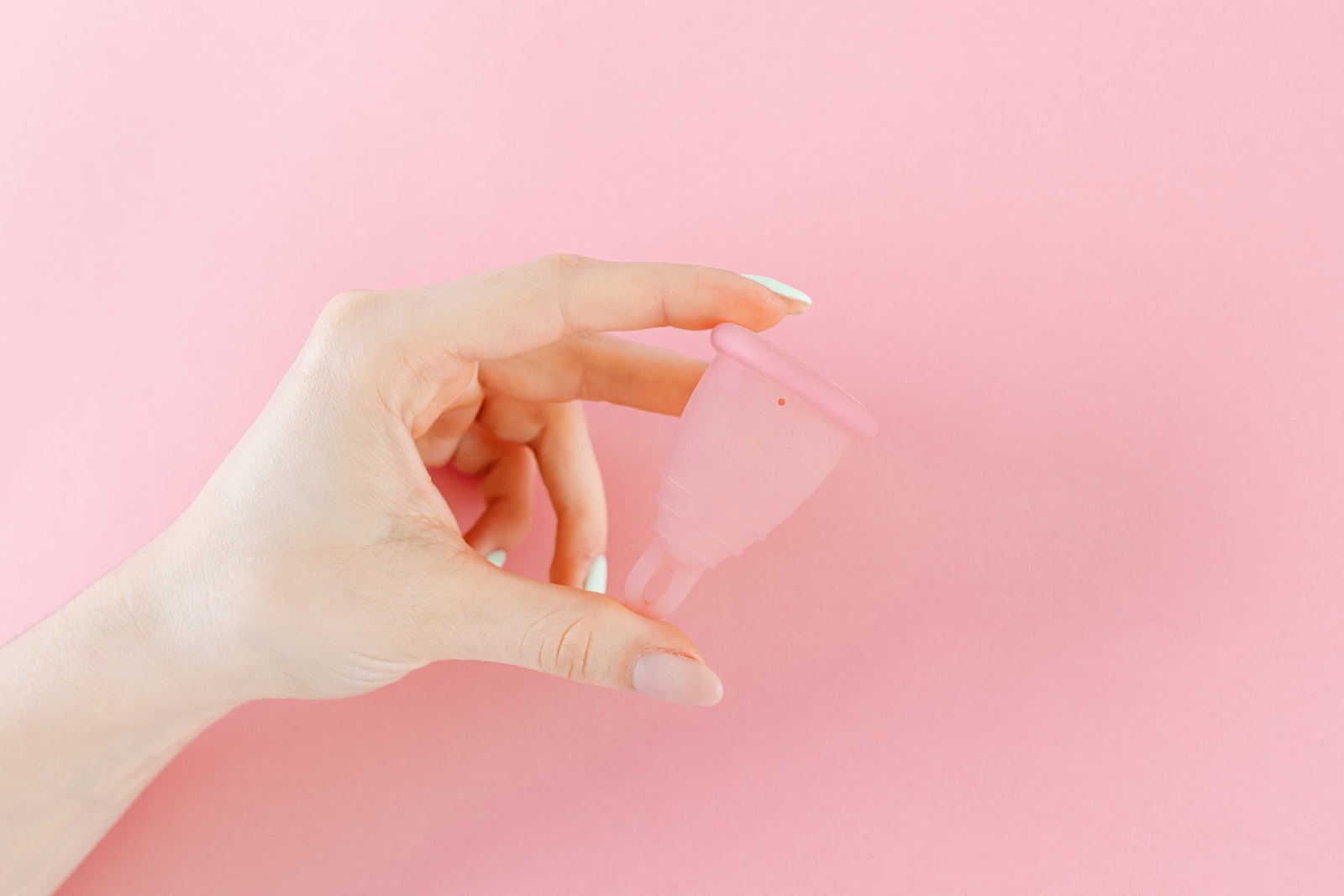 A Person Holding a Menstrual Cup