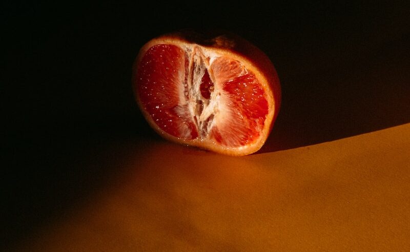 red apple fruit on yellow textile